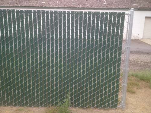 Chain link fence with privacy slats