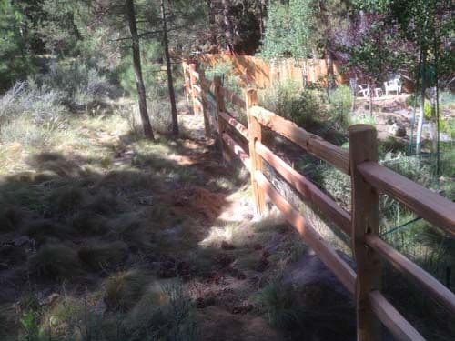 Photo of rough hewn livestock fencing.