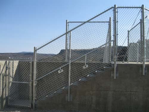 Chain link fence for stairway